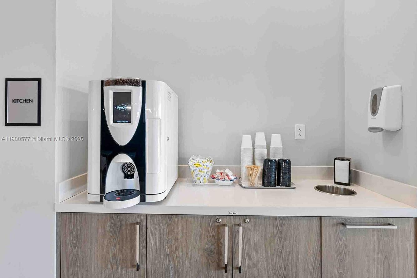 14502 Sloan Rdg Drive, Unit LUMINOSA Delray Beach, FL 33446 - Photo 9 of 49 a bathroom with a sink and a mirror