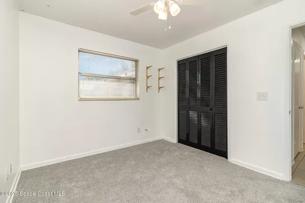 an empty room with a empty space and windows