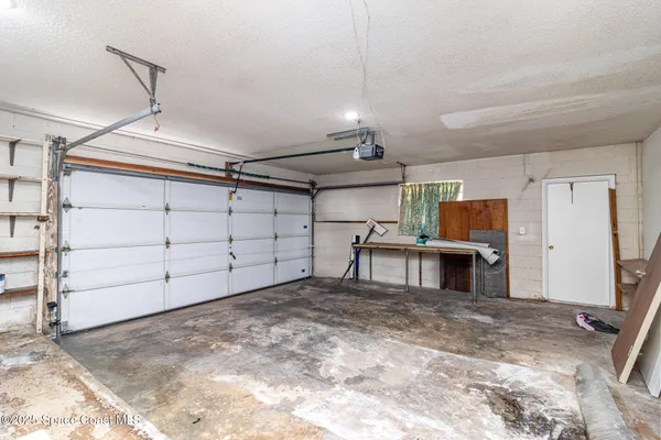 a view of an empty room with a large window