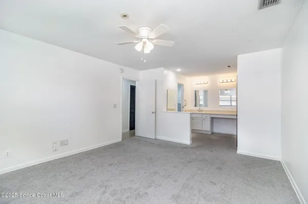 a view of a kitchen with a sink and a window
