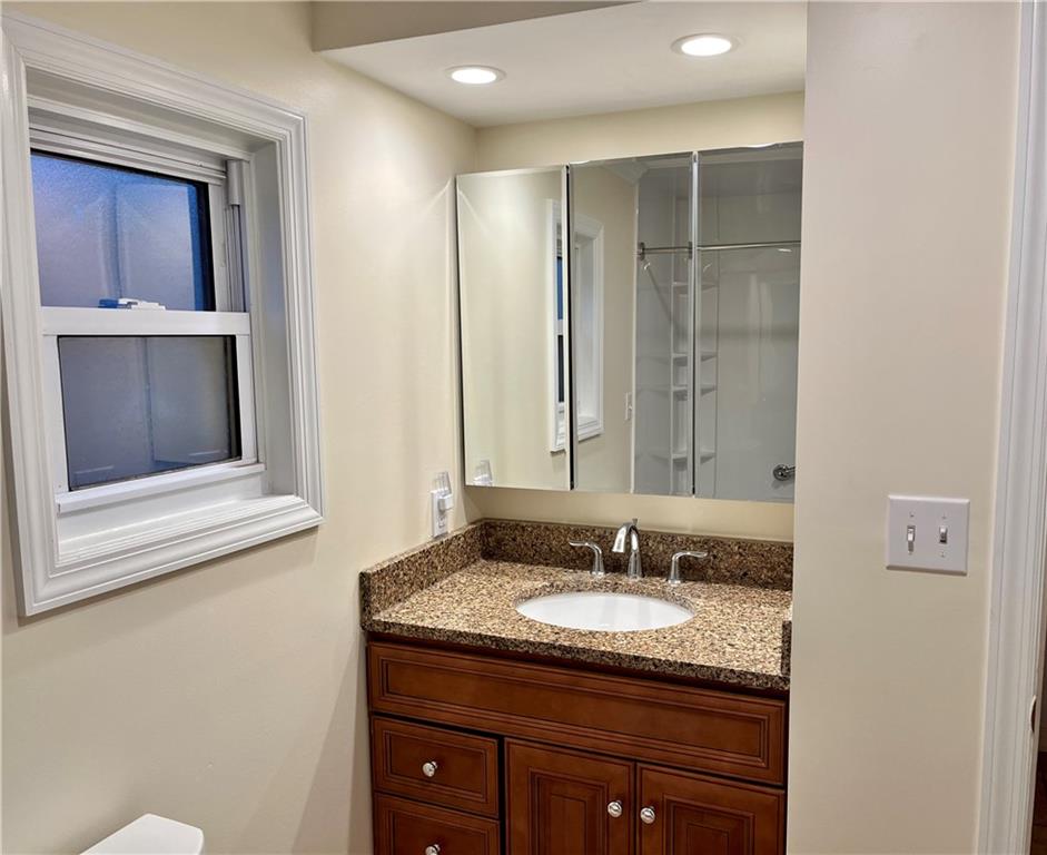 312 Zero Street Carnegie, PA 15106 - Photo 11 of 22 a bathroom with a granite countertop sink and a mirror