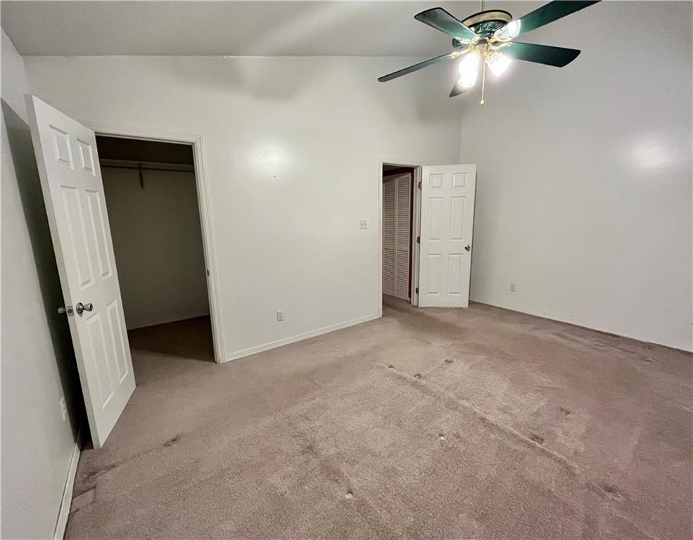 312 Zero Street Carnegie, PA 15106 - Photo 12 of 22 an empty room with closet and a chandelier fan