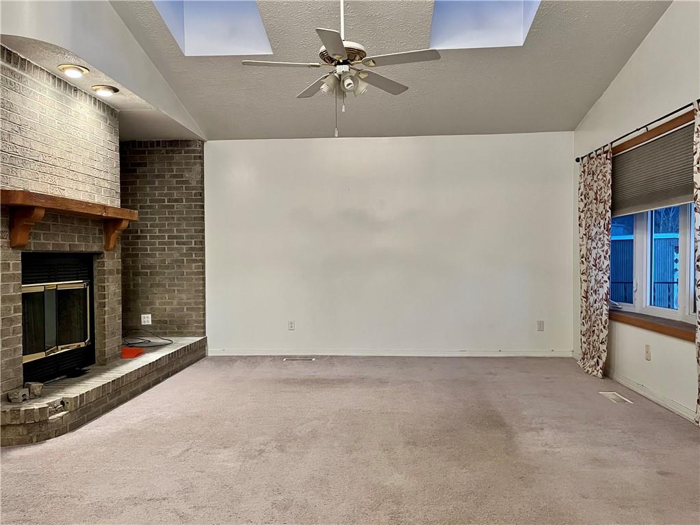 312 Zero Street Carnegie, PA 15106 - Photo 4 of 22 an empty room with windows and fireplace