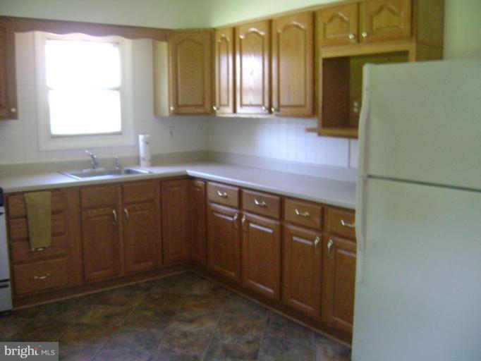 3107 Grace Road Sparrows Point, MD 21219 - Photo 3 of 7 a kitchen with a sink and cabinets