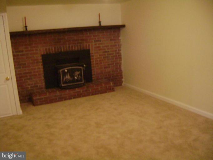 3107 Grace Road Sparrows Point, MD 21219 - Photo 5 of 7 a stone house with a fireplace
