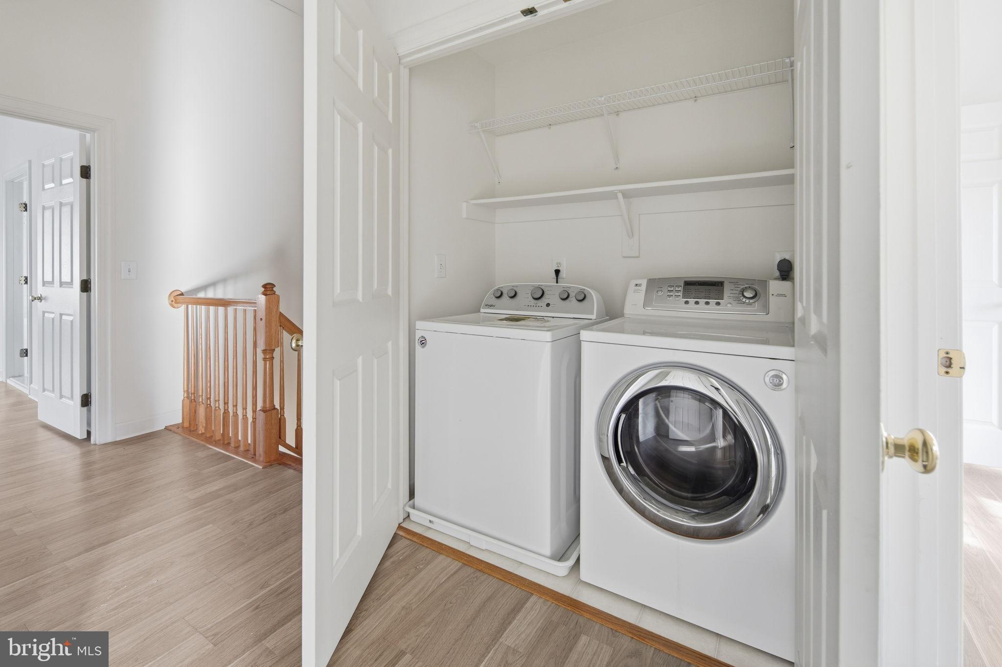 8026 Kidwell Hill Court Vienna, VA 22182 - Photo 16 of 22 a utility room with dryer and washer
