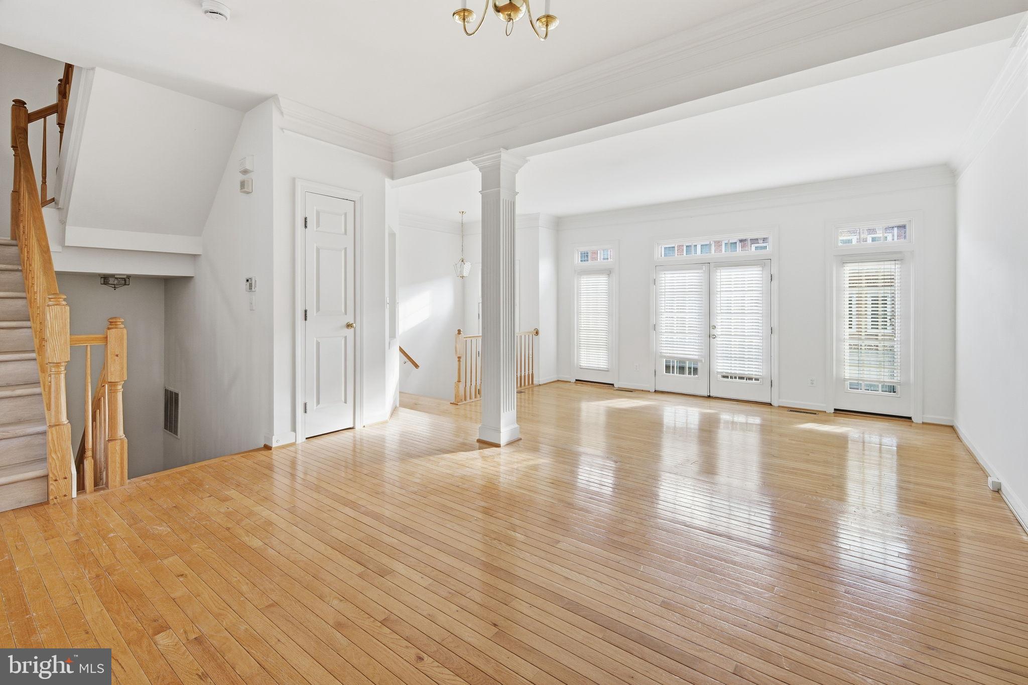 8026 Kidwell Hill Court Vienna, VA 22182 - Photo 3 of 22 a view of a livingroom with wooden floor