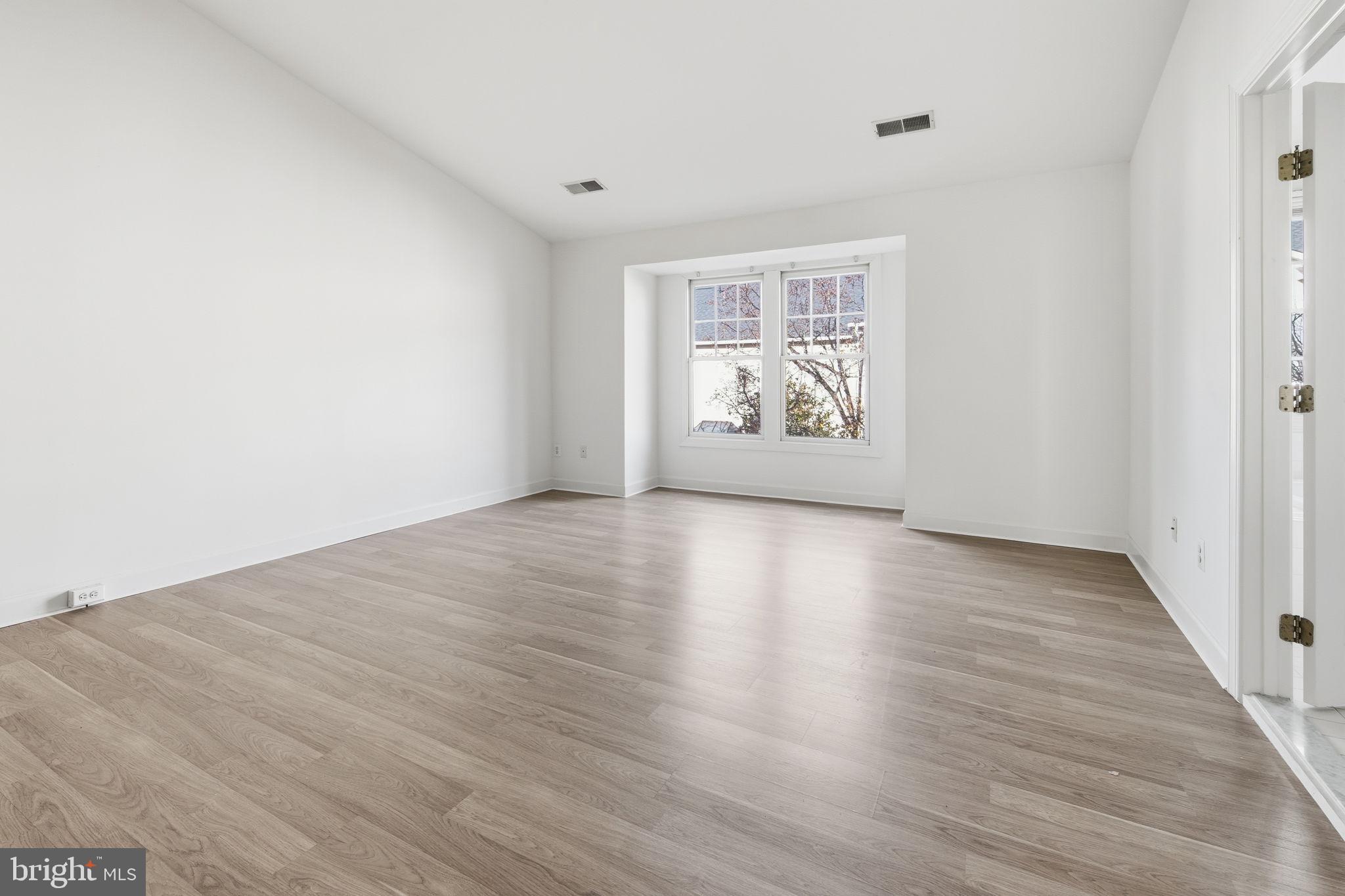 8026 Kidwell Hill Court Vienna, VA 22182 - Photo 10 of 22 a view of room with wooden floor and window