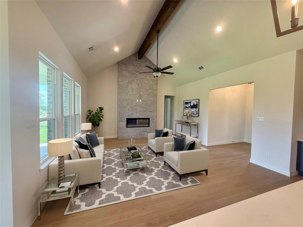 216 Slimp Bluff Azle, TX 76020 - Photo 2 of 26 a living room with furniture and a fireplace