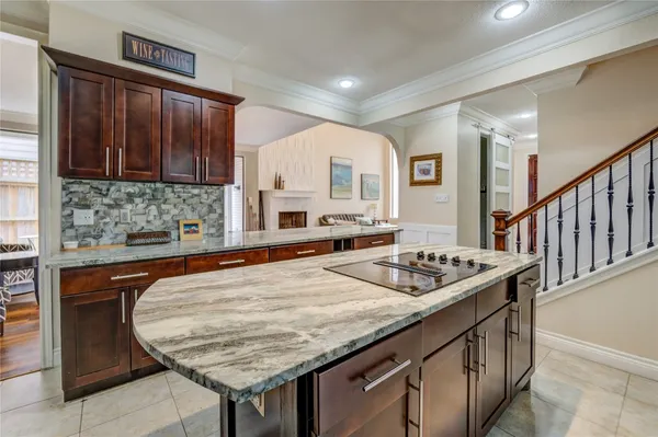 a kitchen with stainless steel appliances granite countertop a sink and cabinets