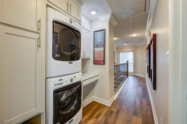 a view of a hallway with washer and dryer