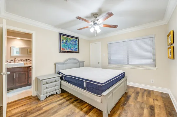 a room with a bed and a chandelier