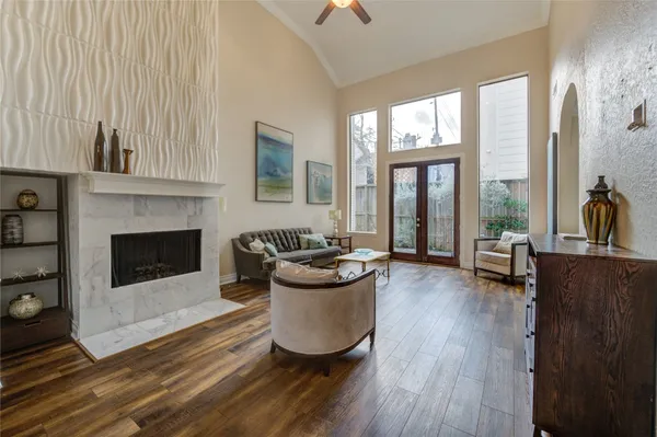 a living room with furniture and a fireplace