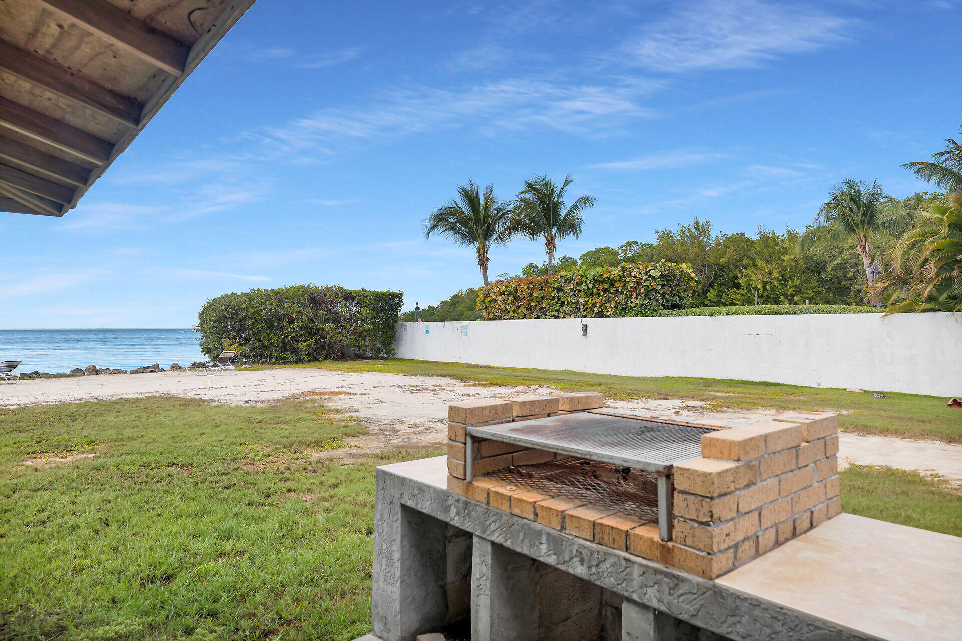 10 Dolphin Road Key Largo, FL 33037 - Photo 51 of 55 a view of a swimming pool and a yard