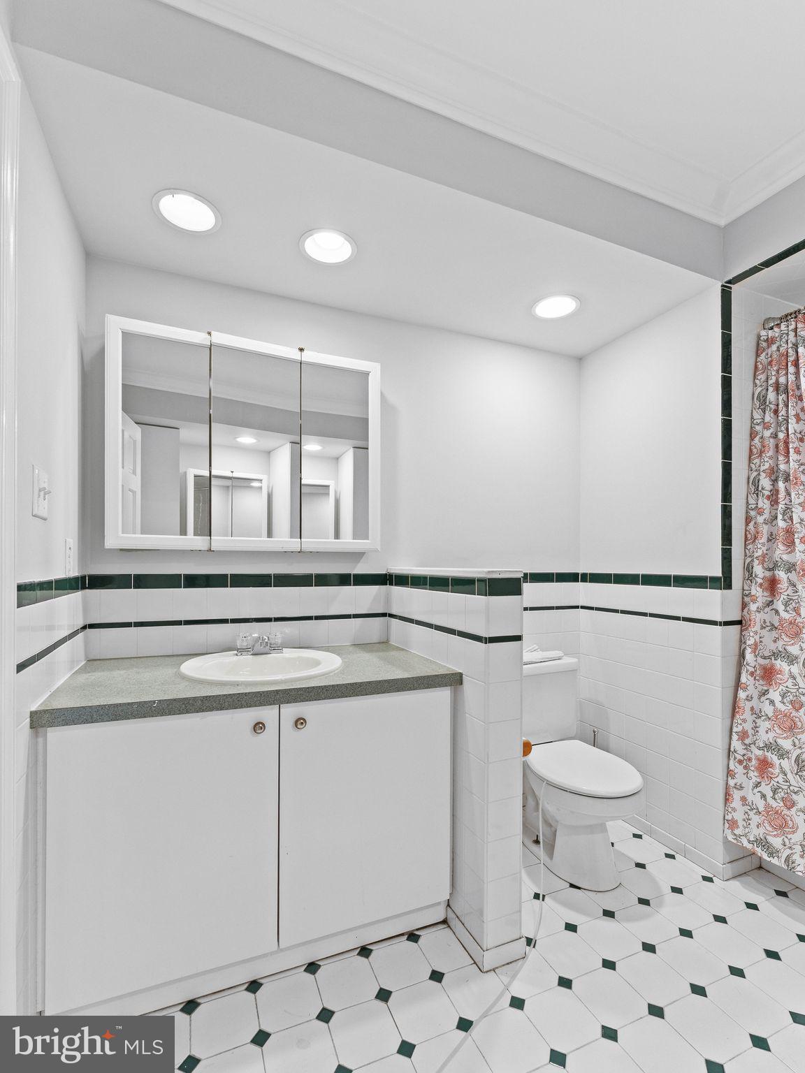 8 Chesterfield Road Sewell, NJ 08080 - Photo 36 of 57 a bathroom with a toilet a sink and a mirror