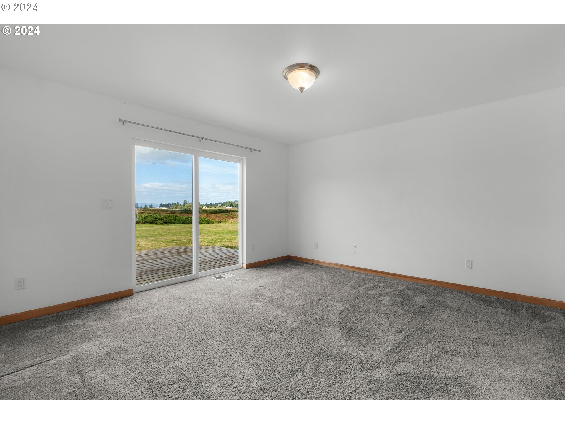 90713 Fort Clatsop Road Astoria, OR 97103 - Photo 11 of 30 a view of an empty room with a window