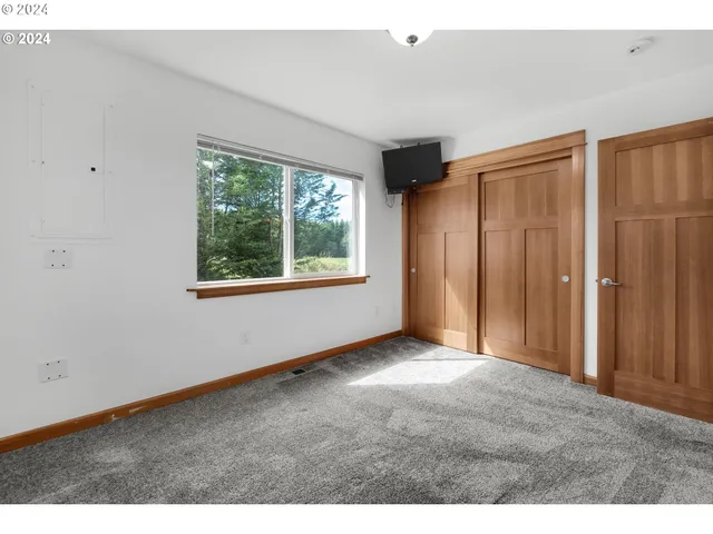 a view of an empty room with a window