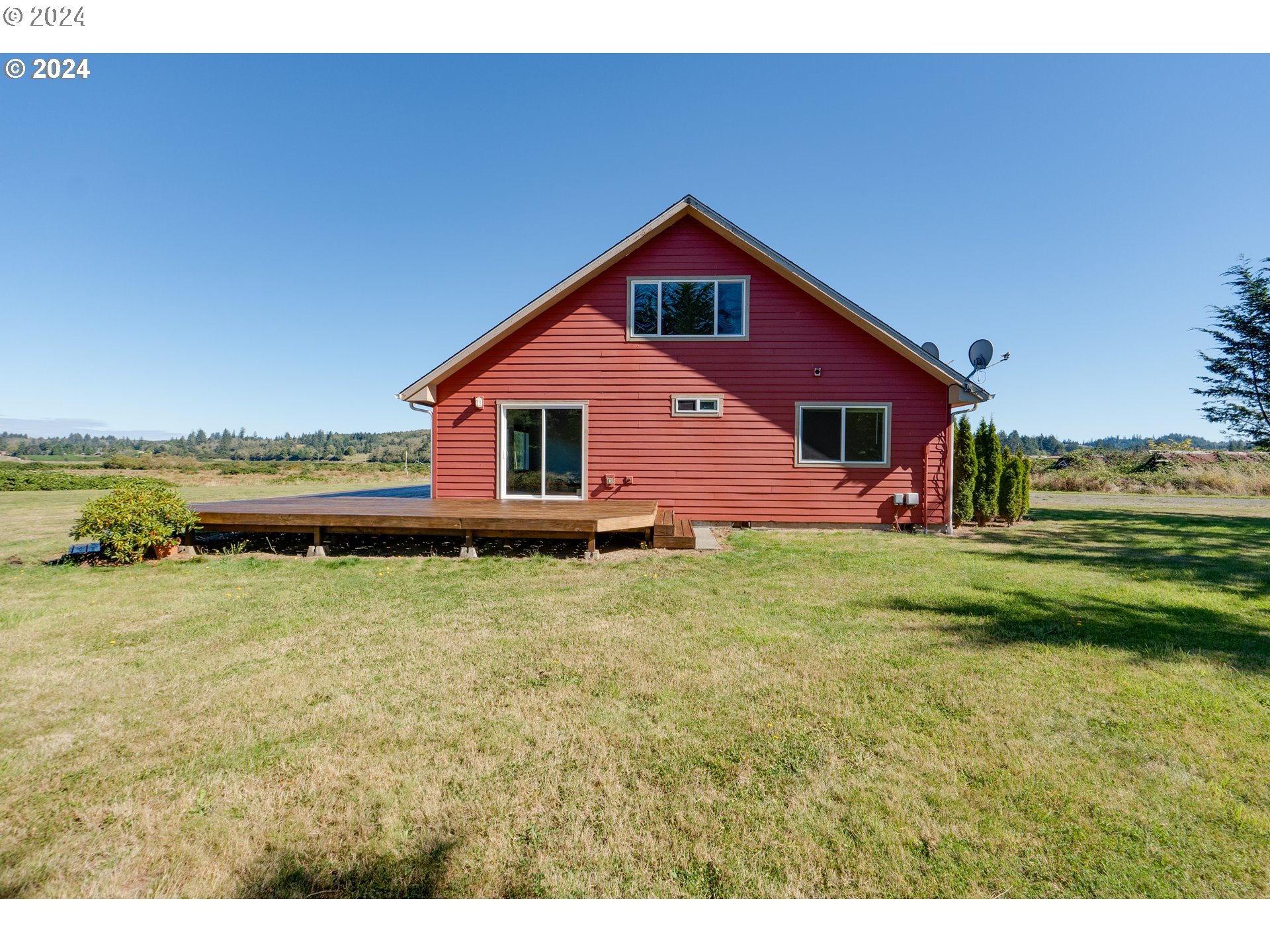 90713 Fort Clatsop Road Astoria, OR 97103 - Photo 27 of 30 a front view of house with outdoor space and trees