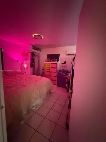 a bed room with a bed and a lamp