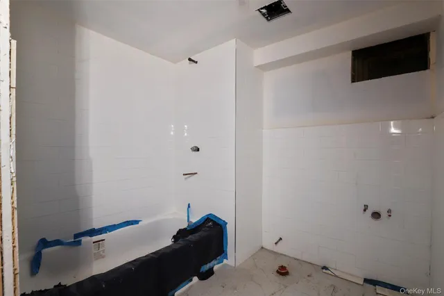 a room with a wooden floor and a sink