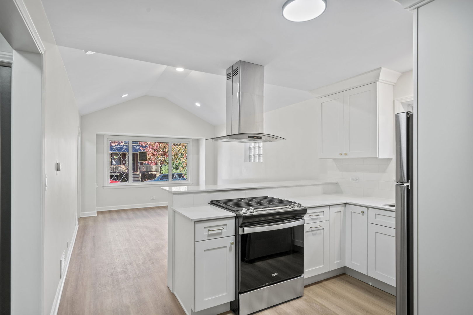 6444 28th Place Berwyn, IL 60402 - Photo 6 of 24 a kitchen with stainless steel appliances a stove and a refrigerator