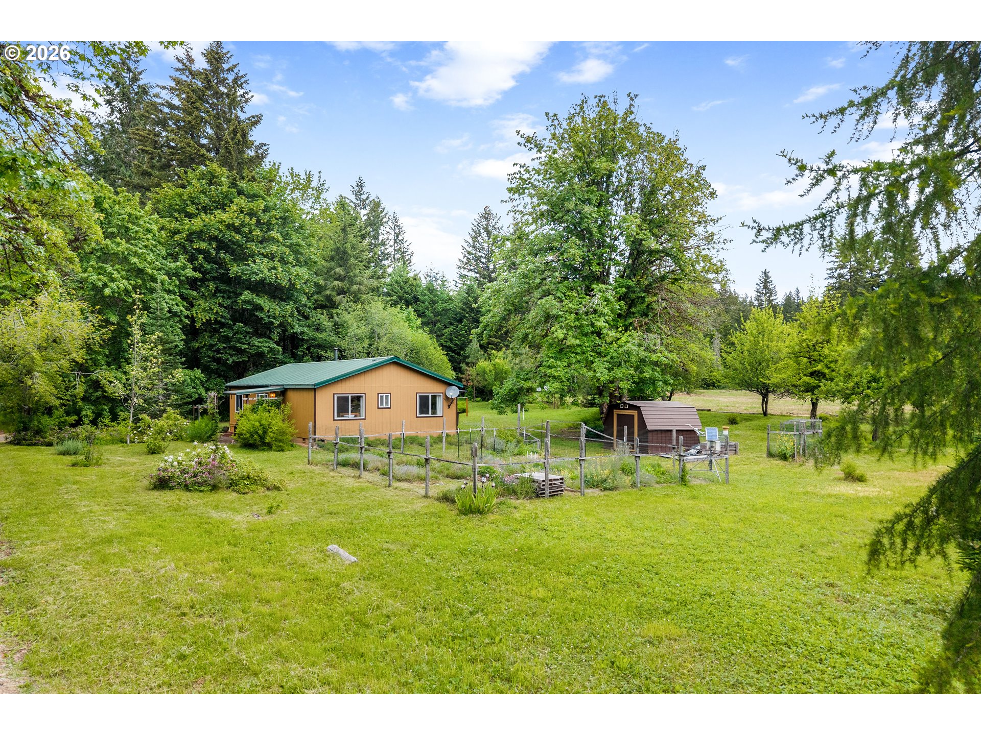 451 Cannavinna Road Carson, WA 98610 - Photo 23 of 33 a backyard of a house with table and chairs