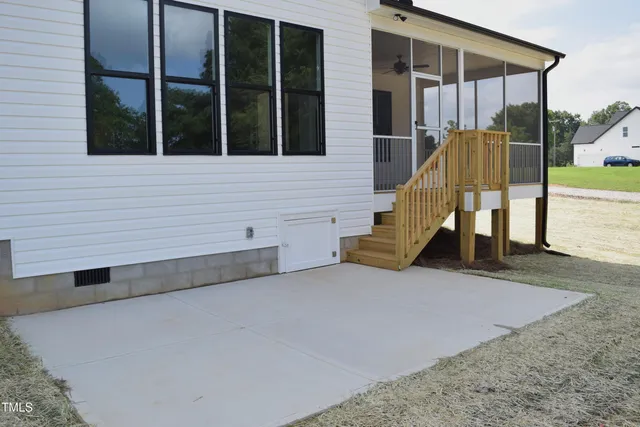 a kitchen with kitchen island a stove a sink a refrigerator and a counter top space