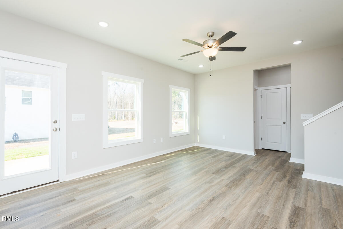1125 Scarlet Oak Rd Spring Spring Hope, NC 27882 - Photo 13 of 29 a view of an empty room with wooden floor and a window