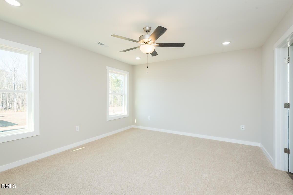 1125 Scarlet Oak Rd Spring Spring Hope, NC 27882 - Photo 21 of 29 an empty room with windows and fan
