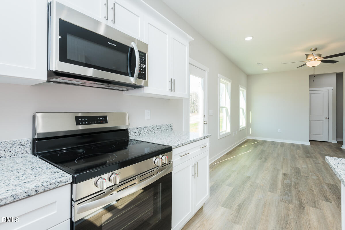 1125 Scarlet Oak Rd Spring Spring Hope, NC 27882 - Photo 10 of 29 a kitchen with a stove and a microwave