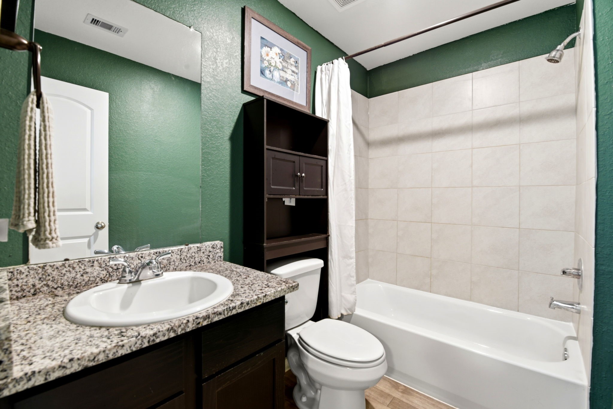 9819 Emerald Stone Way Conroe, TX 77306 - Photo 24 of 38 a bathroom with a sink and a mirror