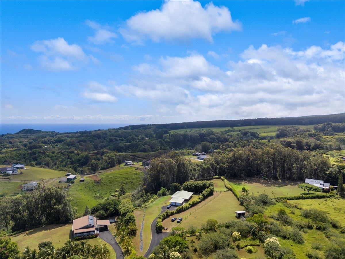 57 Awalau Road, Unit A Haiku, HI 96708 - Photo 20 of 22 a view of a city with mountains in the background