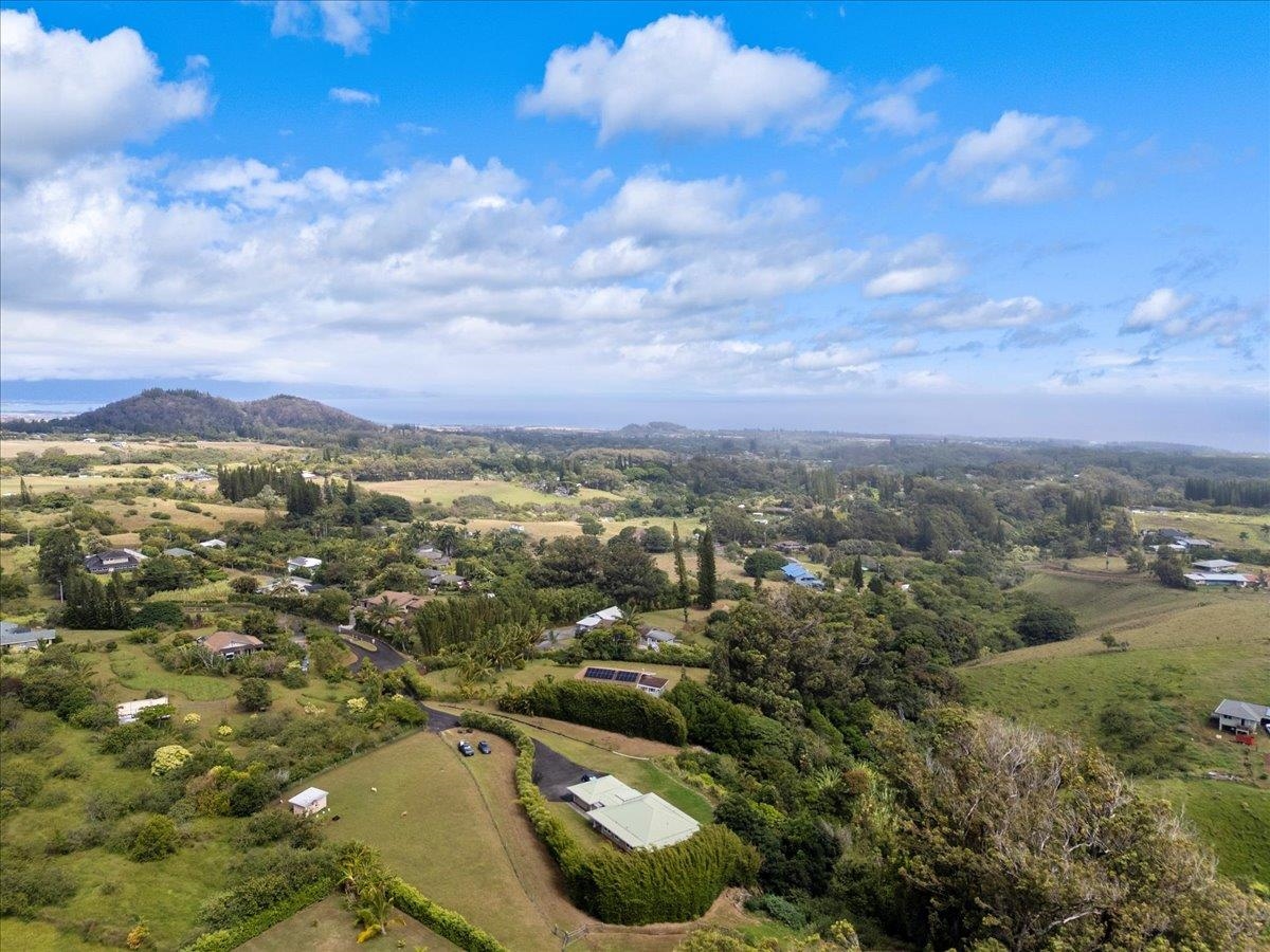 57 Awalau Road, Unit A Haiku, HI 96708 - Photo 21 of 22 a view of a city with mountains in the background