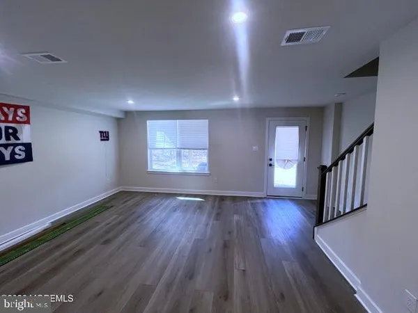 a bathroom with a sink a toilet a mirror and shower