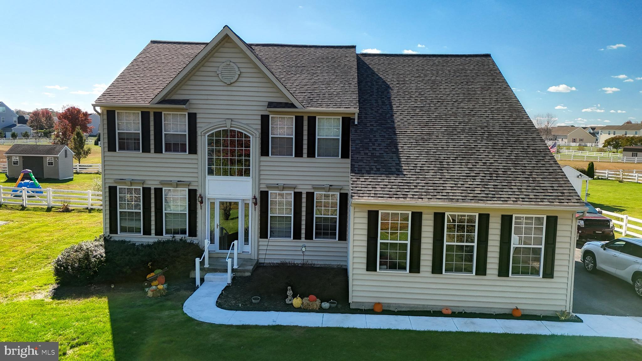 a front view of a house with a yard