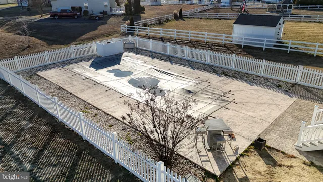a view of a backyard with sitting area