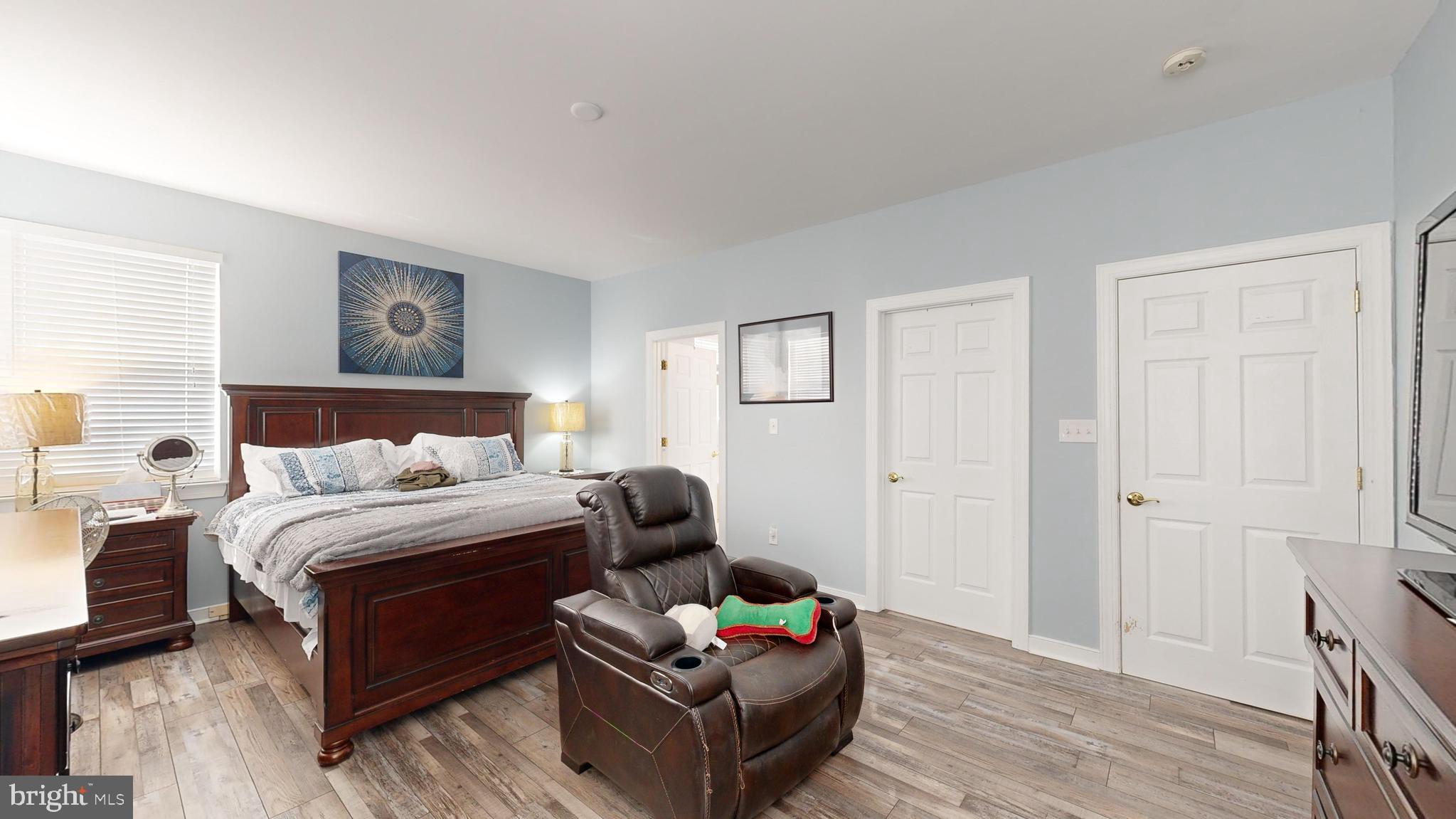 24875 Rivers Edge Road Millsboro, DE 19966 - Photo 18 of 48 a bedroom with bed couch and window