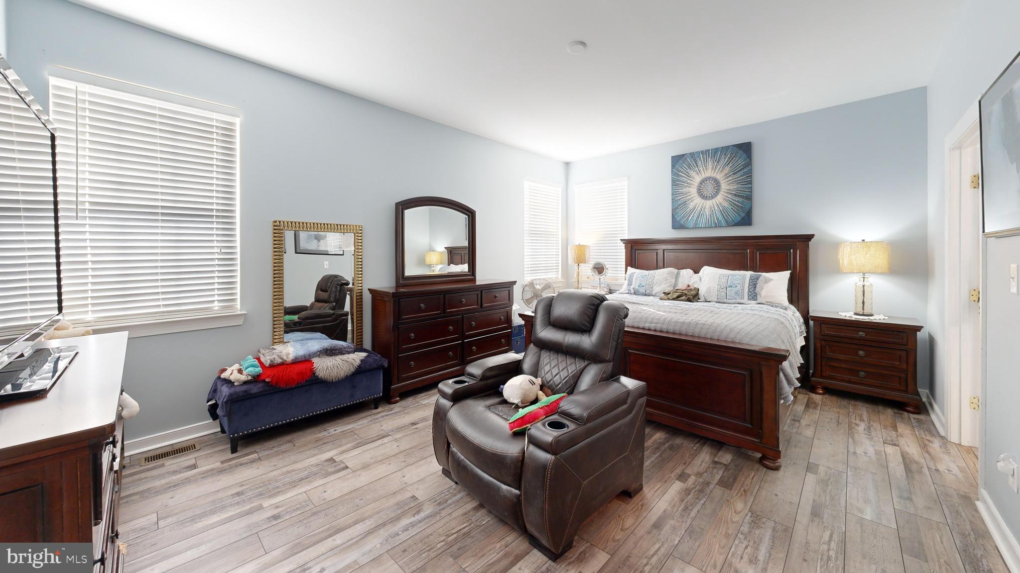 24875 Rivers Edge Road Millsboro, DE 19966 - Photo 19 of 48 a living room with furniture or couch and a dresser