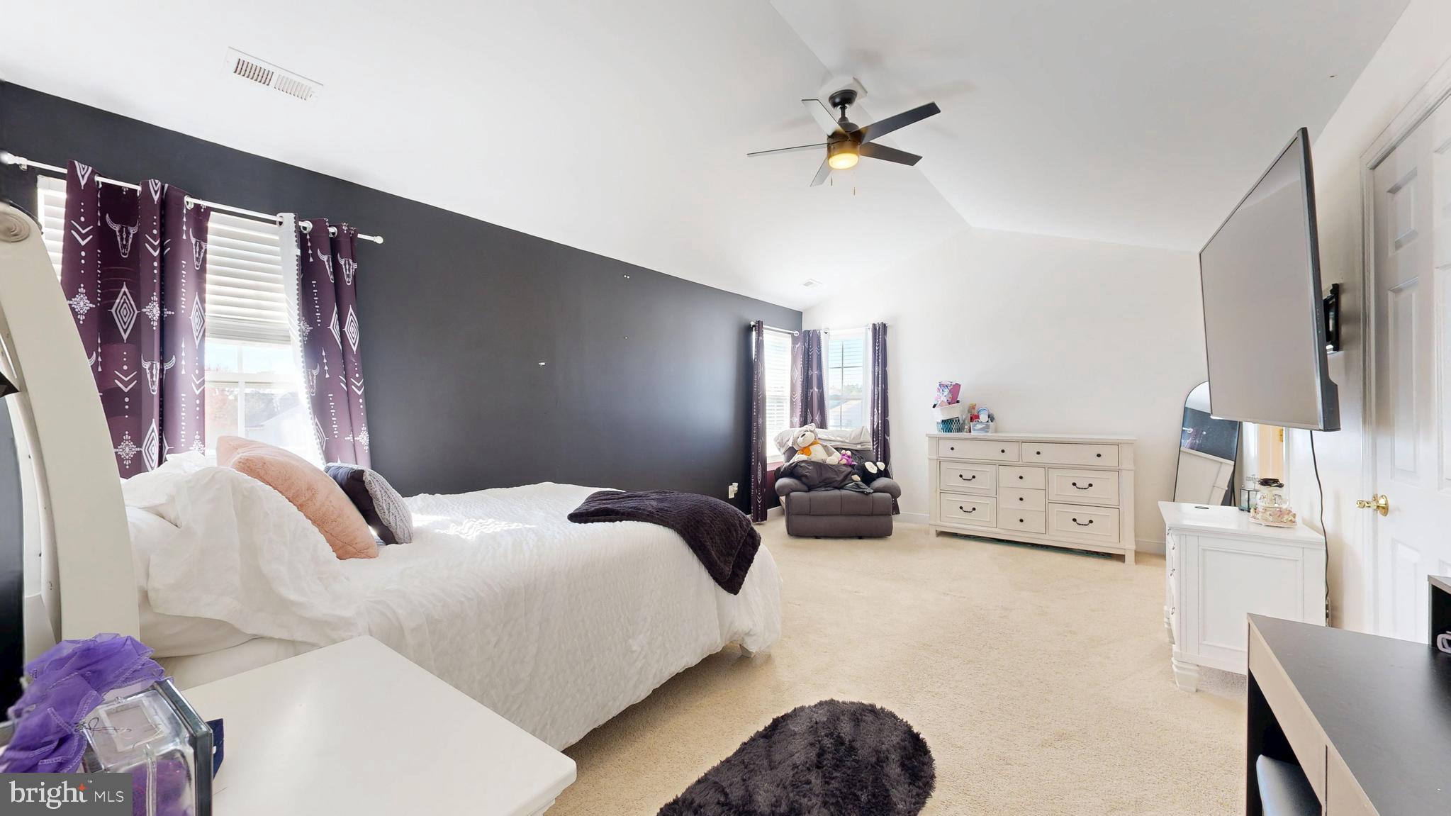 24875 Rivers Edge Road Millsboro, DE 19966 - Photo 23 of 48 a bedroom with furniture and a large window