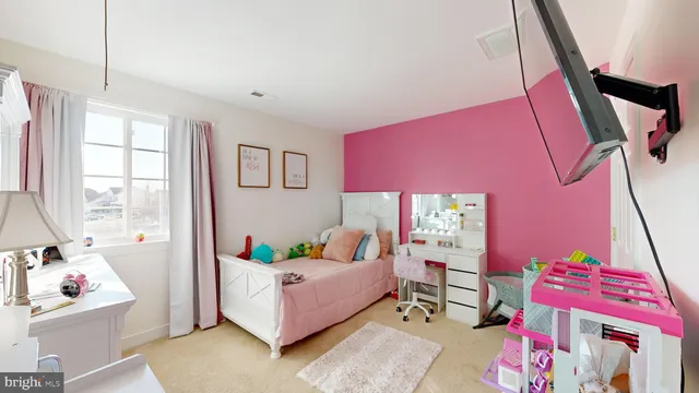 a bedroom with furniture and a window