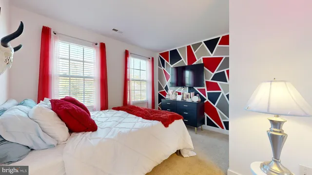 a bedroom with a bed and a closet