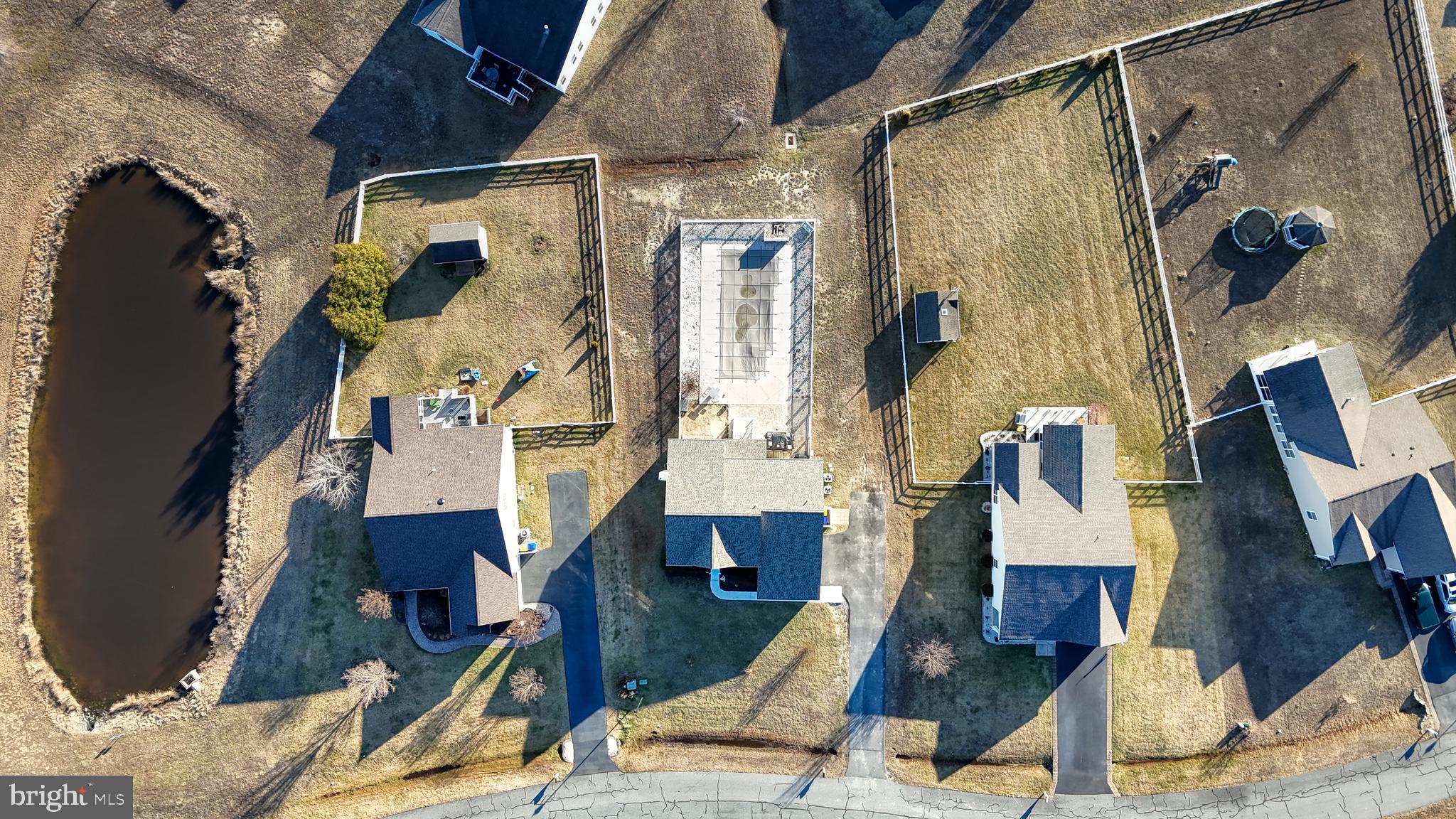 24875 Rivers Edge Road Millsboro, DE 19966 - Photo 36 of 48 a view of walk in closet with clothes and shoes