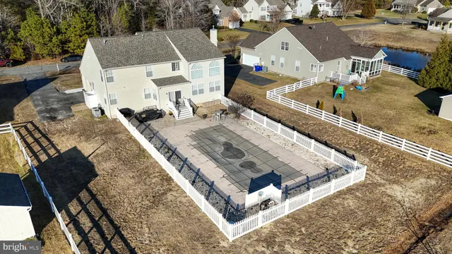 swimming pool view with a sitting space