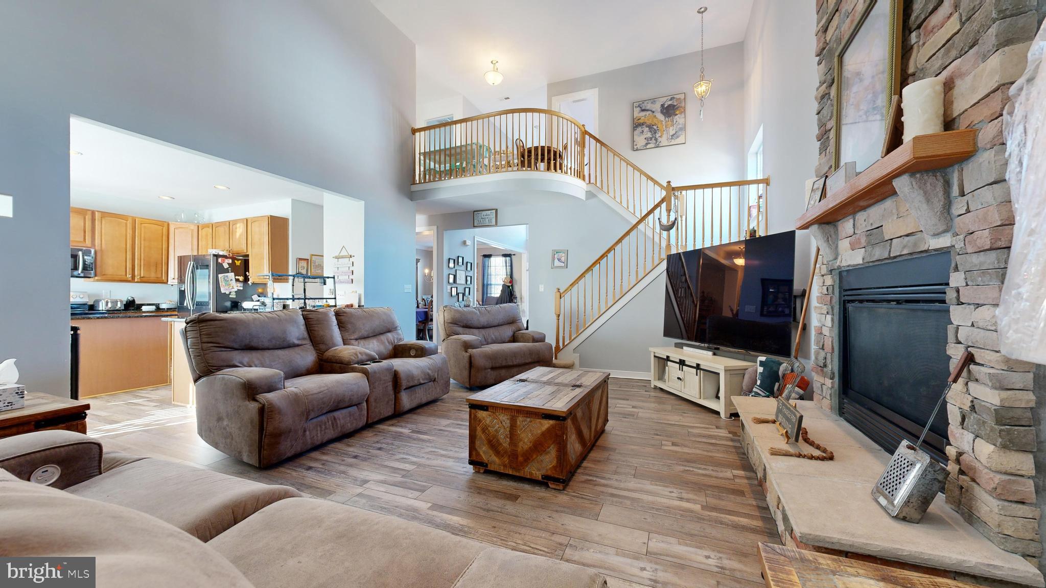 24875 Rivers Edge Road Millsboro, DE 19966 - Photo 8 of 48 a living room with furniture and a flat screen tv