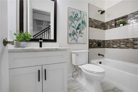 a bathroom with a sink vanity and a mirror