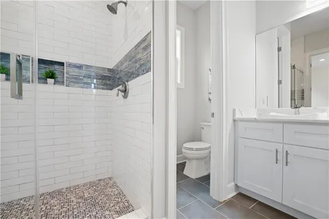 a living room with furniture a couch and potted plant