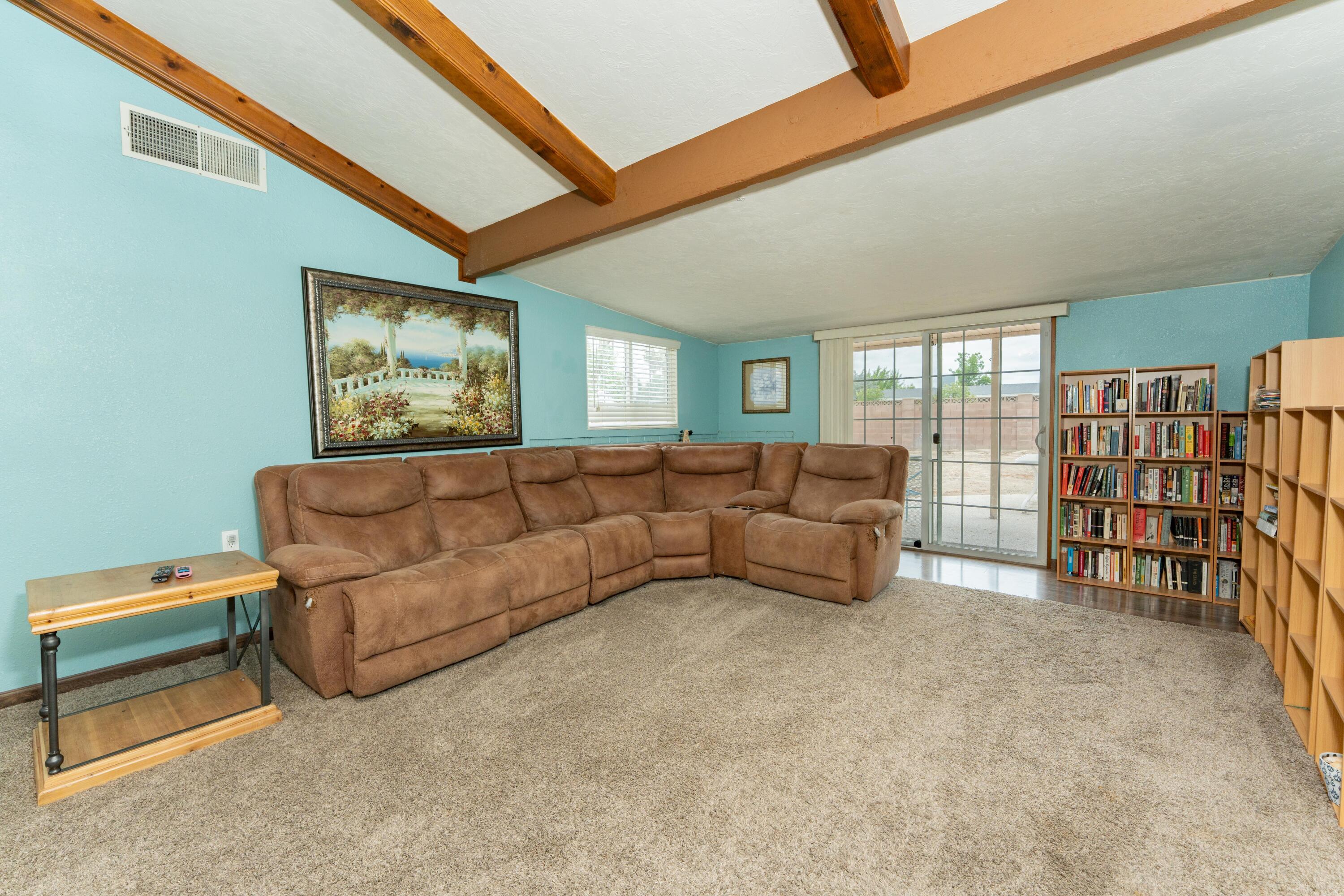 570 North Birch Avenue Reedley, CA 93654 - Photo 24 of 52 a living room with furniture a ceiling fan and a rug