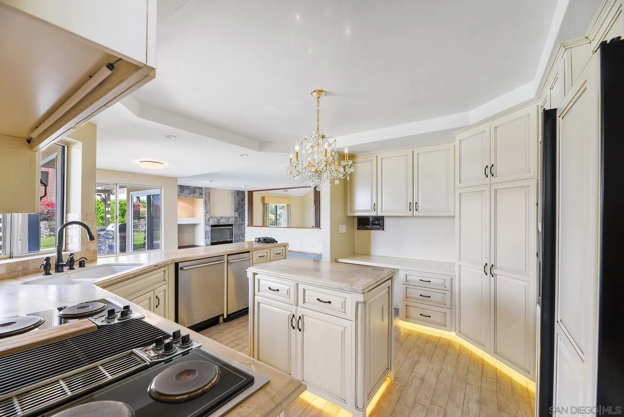 13000 Lomas Verdes Drive Poway, CA 92064 - Photo 11 of 58 a kitchen with a sink stove and cabinets