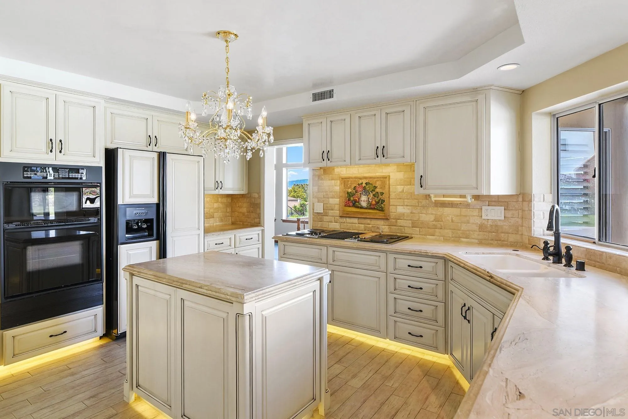 13000 Lomas Verdes Drive Poway, CA 92064 - Photo 13 of 58 a kitchen with stainless steel appliances granite countertop a sink stove and refrigerator