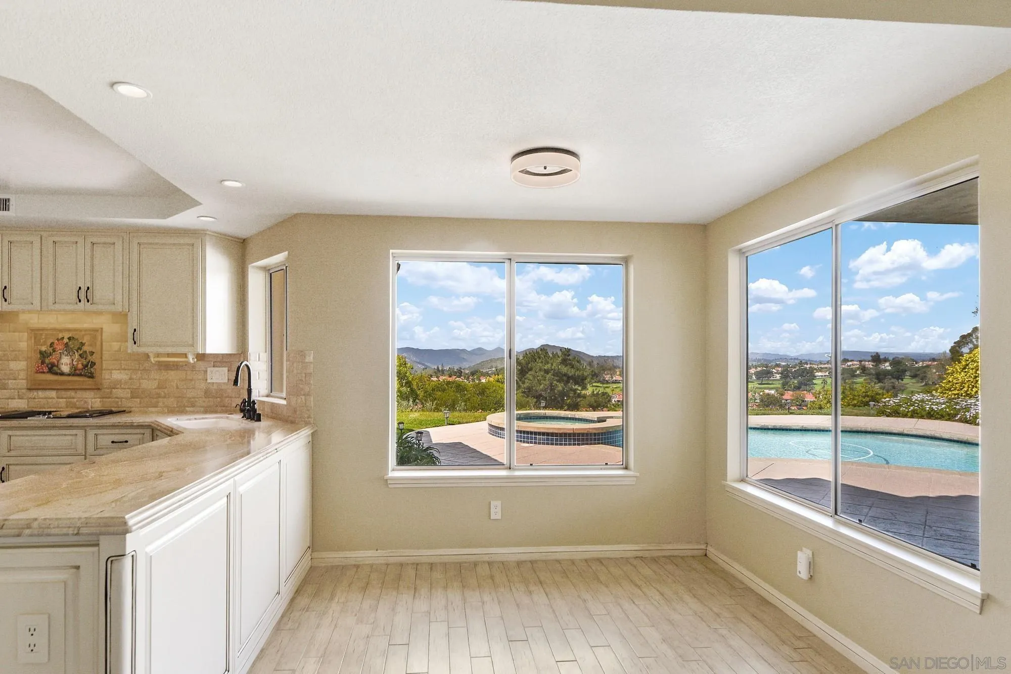 13000 Lomas Verdes Drive Poway, CA 92064 - Photo 16 of 58 a view of a kitchen with a sink and windows
